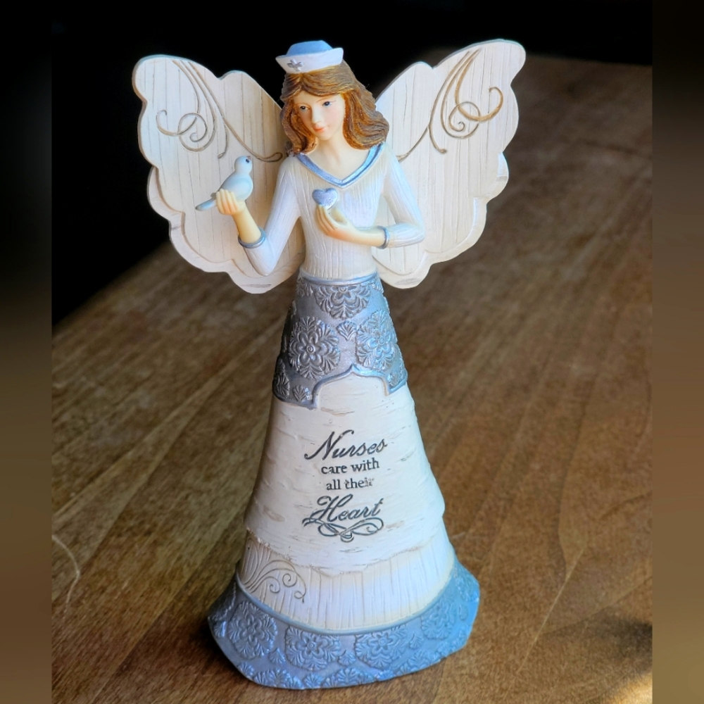 Nurse angel figurine. Inscription: Nurses care with all their heart